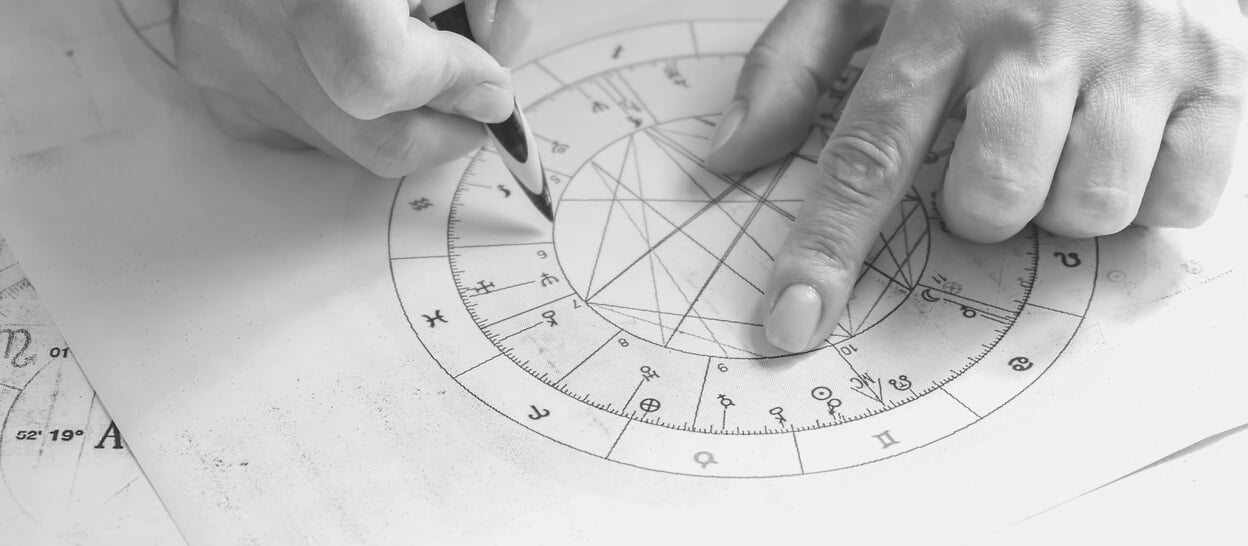 Astrology. Astrologer calculates a natal chart and makes a forecast of fate